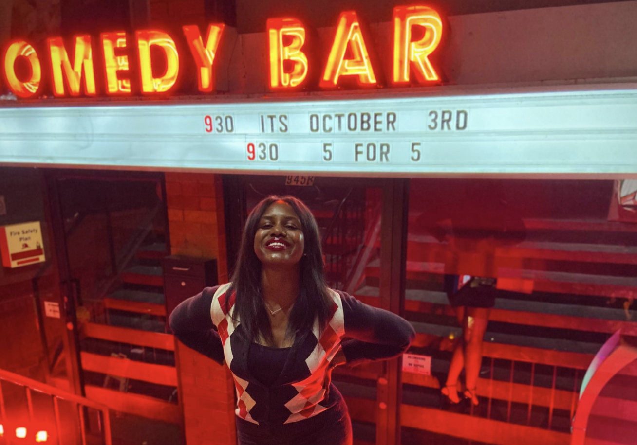 ZILLAH FERGUSON SMILES WHILE STANDING IN FRONT OF COMEDY BAR’S BLOOR STREET LOCATION. 